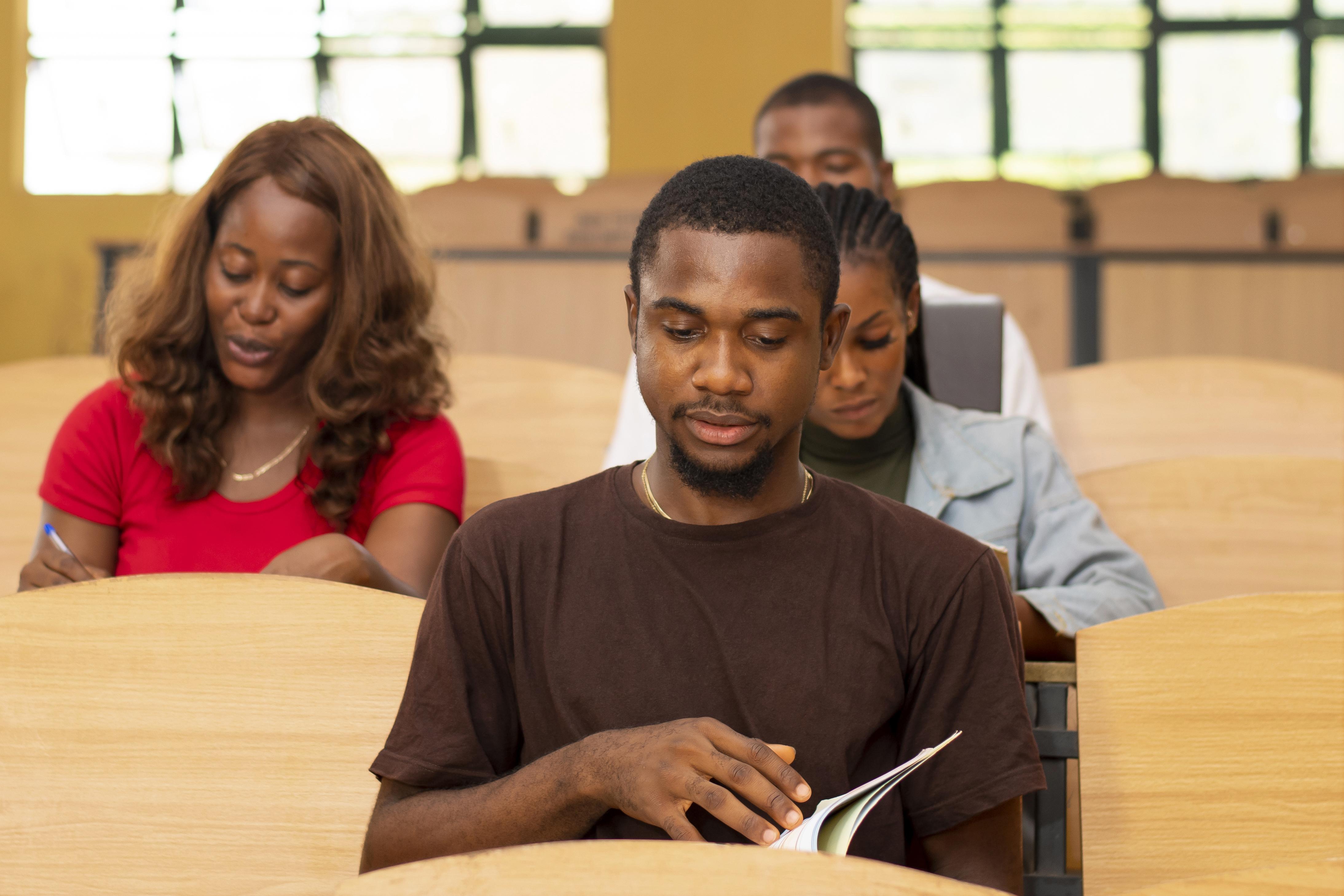 Students engaged in learning at a conference-style setting